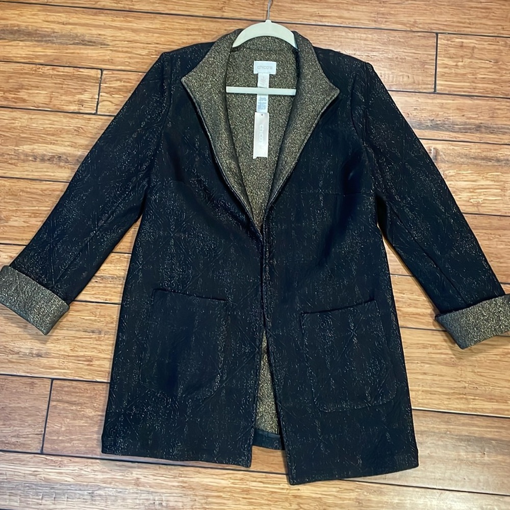 A new chicos size 1 long light jacket black and gold mostly black